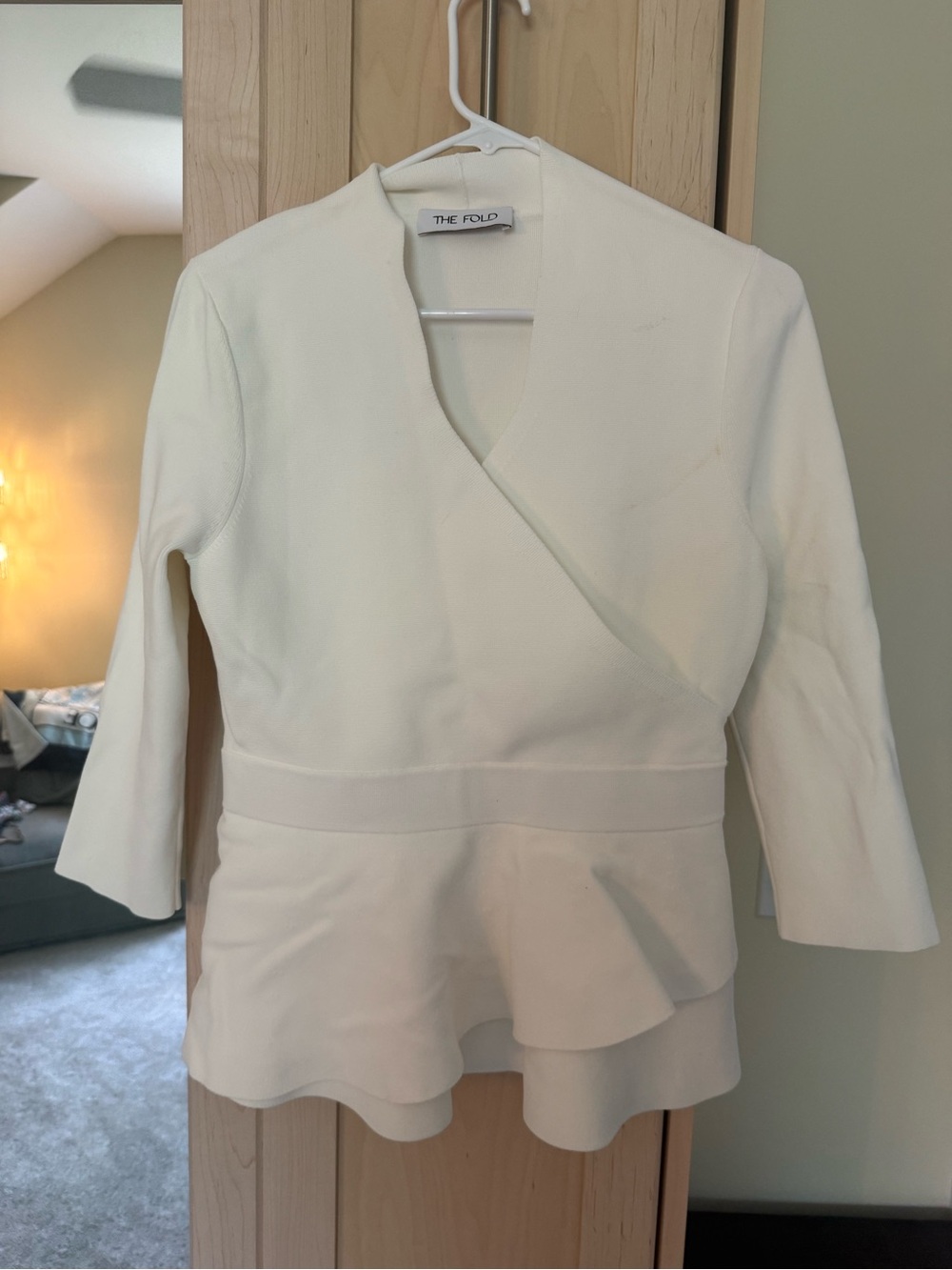 The Fold White Wrap Peplum Blouse